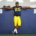 Michigan senior Kenny Demens relaxes against a pad during media day at the Al Glick Field House on Sunday afternoon. Melanie Maxwell I AnnArbor.com